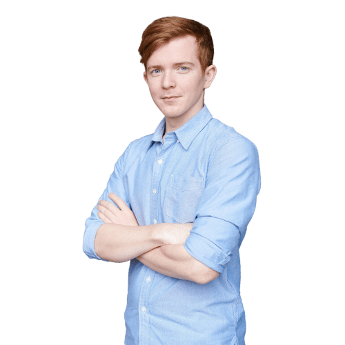 Image shows a person wearing a blue shirt crossing their arms in a confident manner.