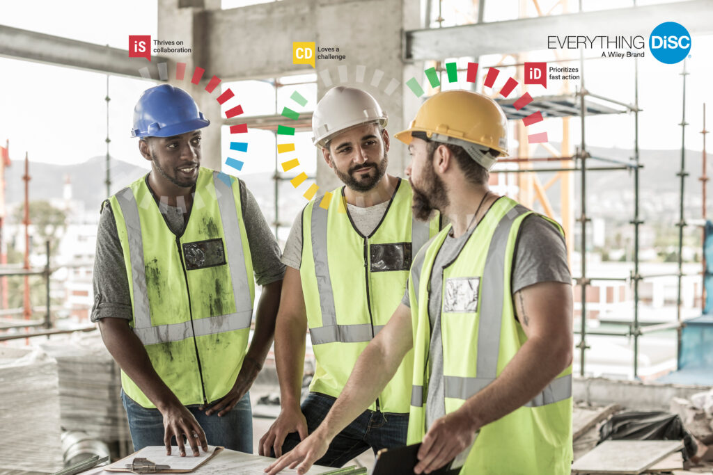 Image shows a group of construction workers talking with a DiSC insight halo around them.