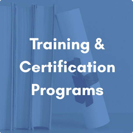 Image shows a picture of books and a diploma on a shelf. The image is darken in a blue hue with the statement "Training & Certification Programs" overlayed on the photo.